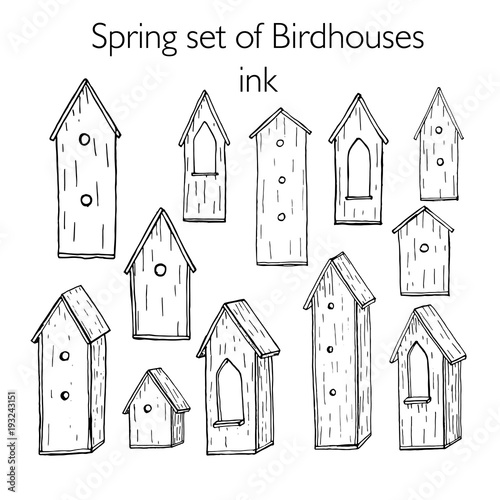 Set of hand drawn ink birdhouses. Strokes on white background.