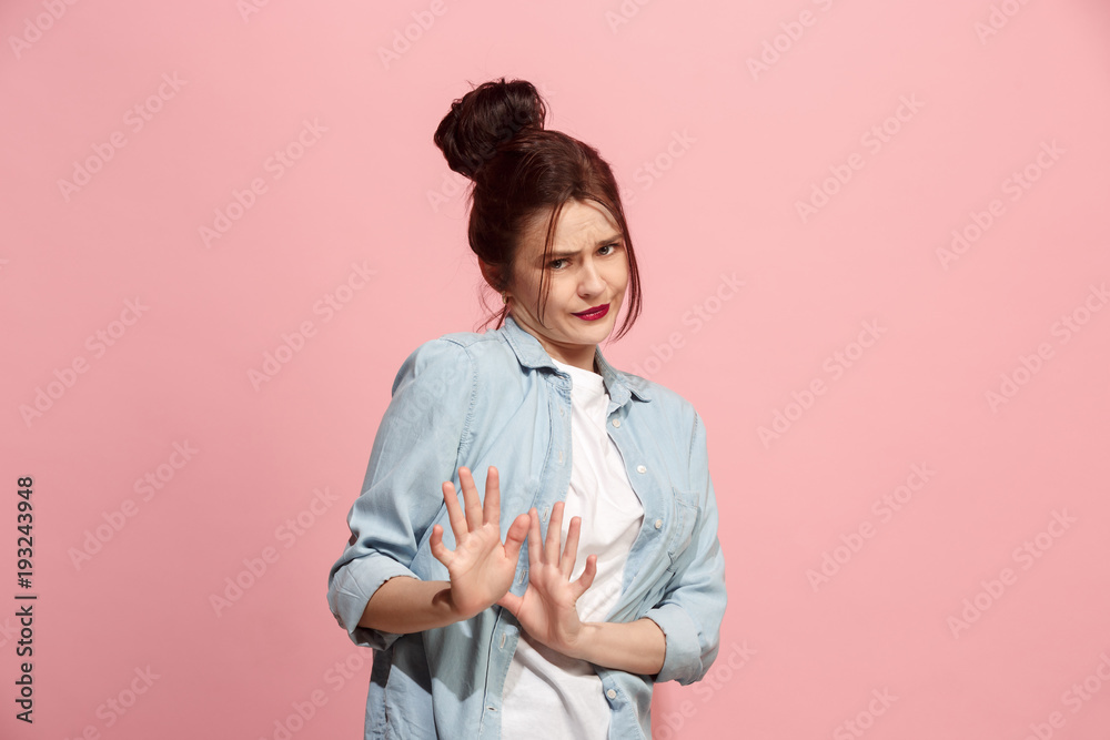 Let me think. Doubtful pensive woman with thoughtful expression making choice against pink background Let me think. Doubtful pensive woman with thoughtful expression making choice against pink background