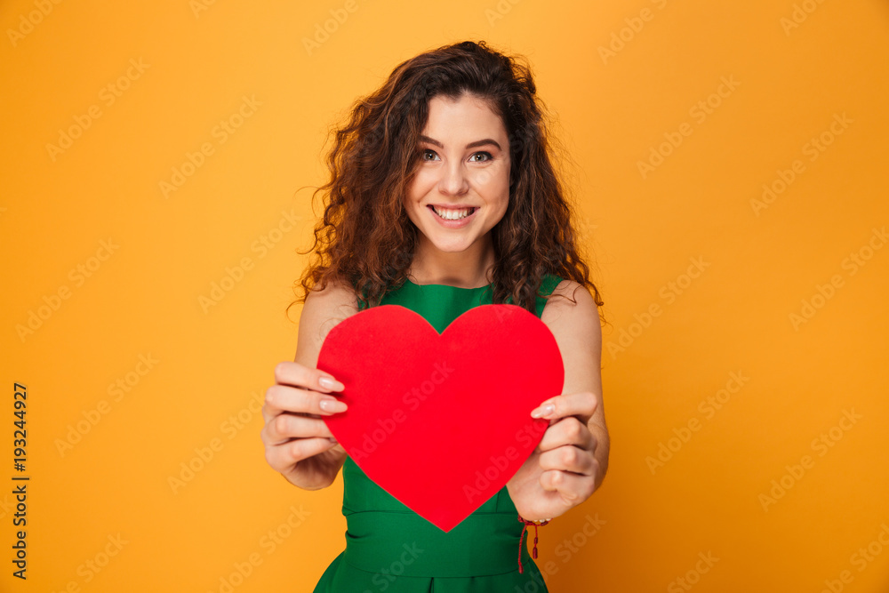 Cute young lady holding heart. Cute young lady holding heart.