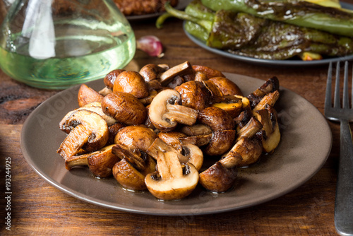 cut barbecue mushrooms and other ingredients on rustic wood