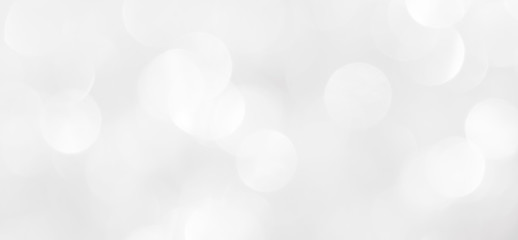 A brilliant blurry white background for a festive mood. Template for greeting card for entertainment.