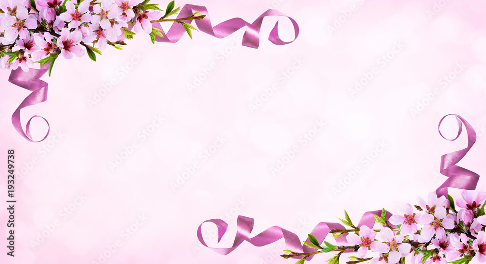 Pink background with spring twigs of peach flowers and silk ribbons Pink background with spring twigs of peach flowers and silk ribbons