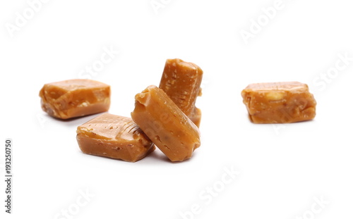 Caramels, pieces isolated on white background