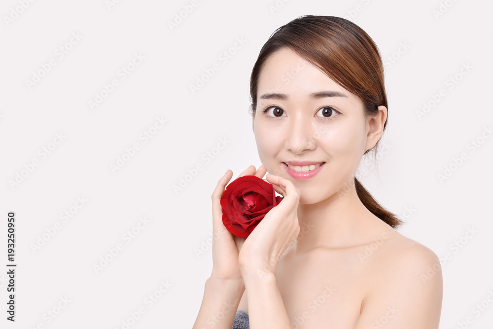 Red rose in woman hands. Smiling pretty woman with a rose. Red rose in woman hands. Smiling pretty woman with a rose.