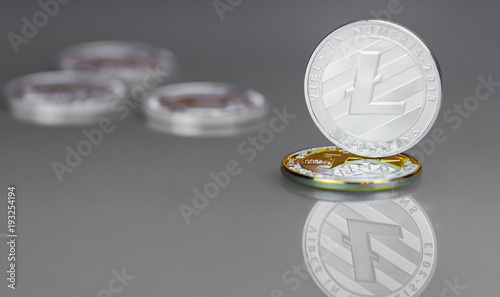 Close-up of a digital silver coin Lightcoin stands on the pedestal photo