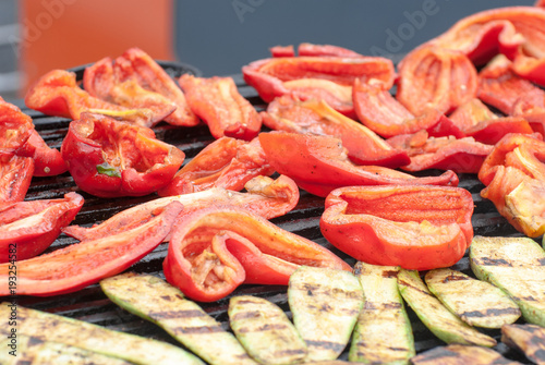 Fried vegetables on the grill, including eggplant, pepper, horizontal photo.