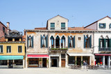 VENICE, ITALY - May 18, 2017 : street view of old buildings in Venice on May 18, 2017. its entirety is listed as a World Heritage Site, along with its lagoon
