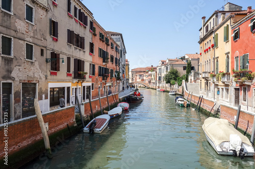 VENICE, ITALY - May 18, 2017 : View of water street and old buildings in Venice on May 18, 2017. its entirety is listed as a World Heritage Site, along with its lagoon