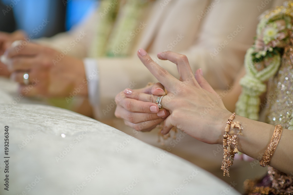 Fototapeta premium Wear a ring. wedding ring . love couple