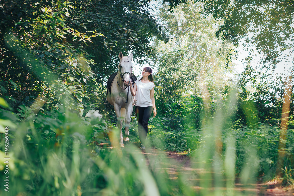 Girl and horse in the woods