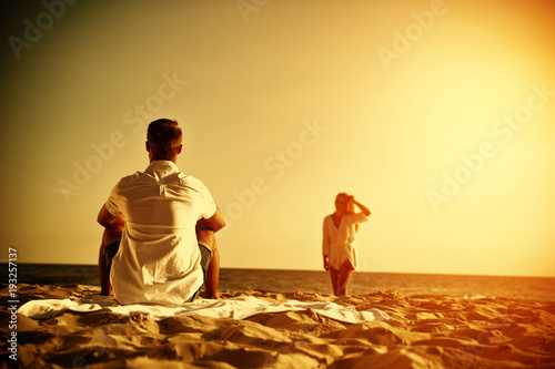 Two lovers on beach and sunset time 