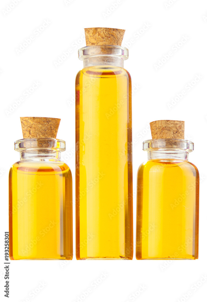 Essence of flowers on table in beautiful glass Bottle Essence of flowers on table in beautiful glass Bottle