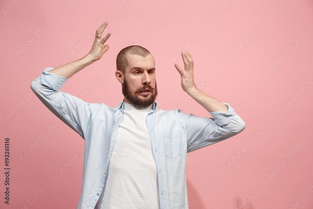 Beautiful man in stress isolated on pink Beautiful man in stress isolated on pink