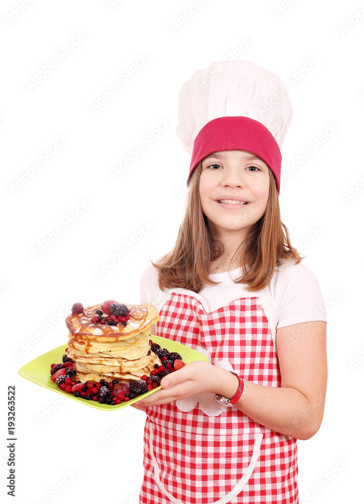 Happy little girl cook with sweet pancakes on plate Happy little girl cook with sweet pancakes on plate