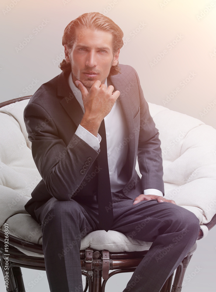 confident businessman sitting in chair confident businessman sitting in chair