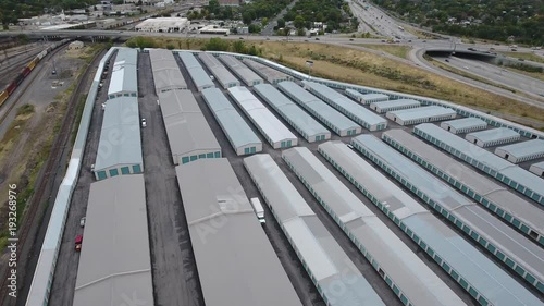 arages and storage units next to a freeway intersection. photo