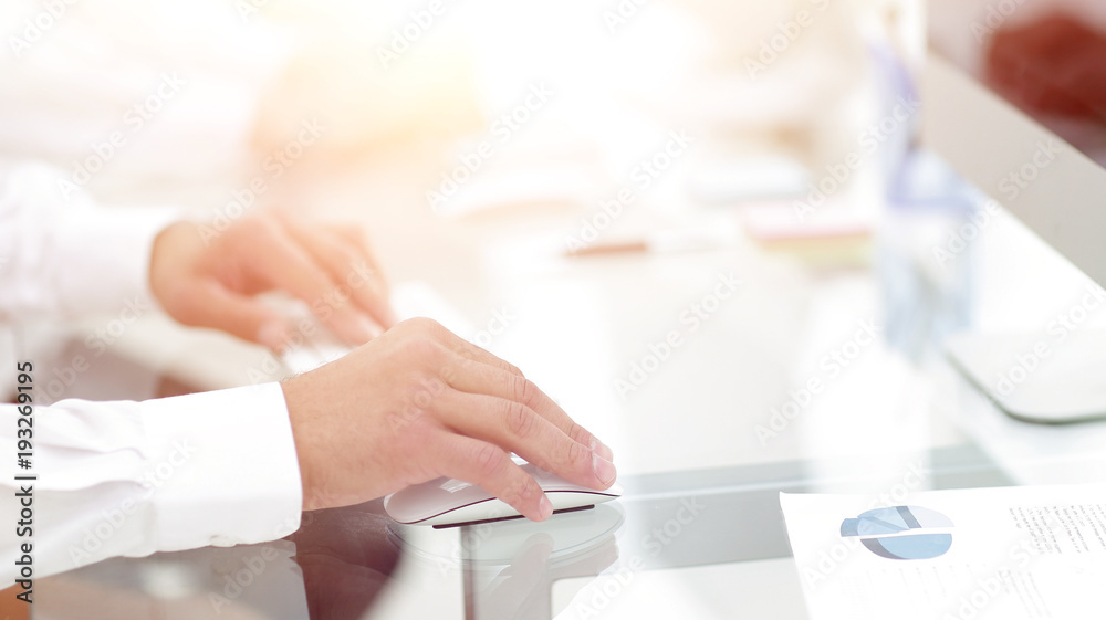 hands typing text on the computer keyboard. blurred business bac hands typing text on the computer keyboard. blurred business bac