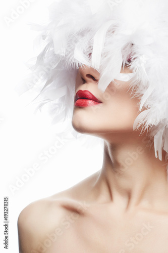 Fototapeta Naklejka Na Ścianę i Meble -  Beautiful Girl in white feathers. Beauty Make-up