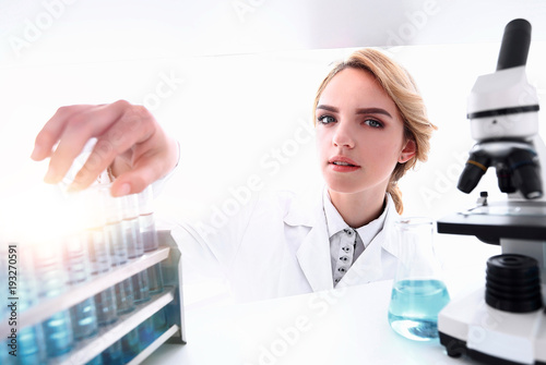 Young woman analyzing samples in a lab