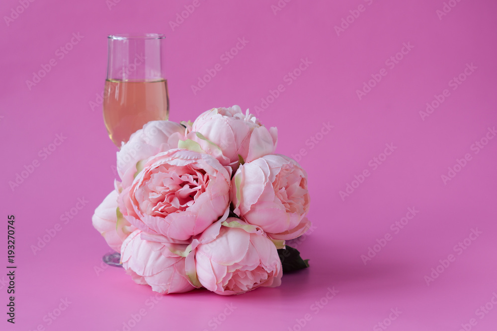 Glass of wine and .bouquet of peonies. Space for text Glass of wine and .bouquet of peonies. Space for text