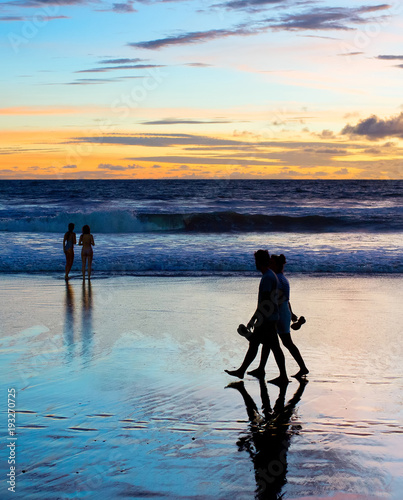 Romantic couple walk  beach Bali photo