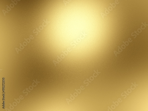 Gold foil background with light reflections photo