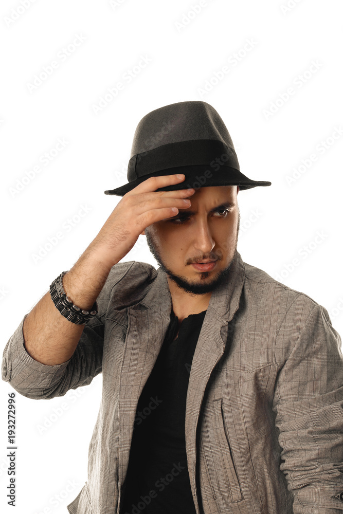 glamour young man in hat and jacket looking away glamour young man in hat and jacket looking away