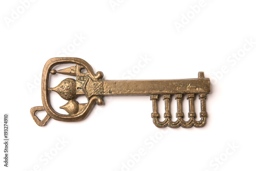 Antique gold key isolated on white background