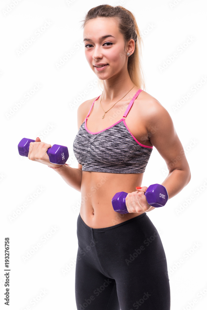 Fitness sport girl smiling happy. Fitness woman lifting dumbbells strength training biceps doing curls. Caucasian fitness model portrait isolated on white background. Fitness sport girl smiling happy. Fitness woman lifting dumbbells strength training biceps doing curls. Caucasian fitness model portrait isolated on white background.