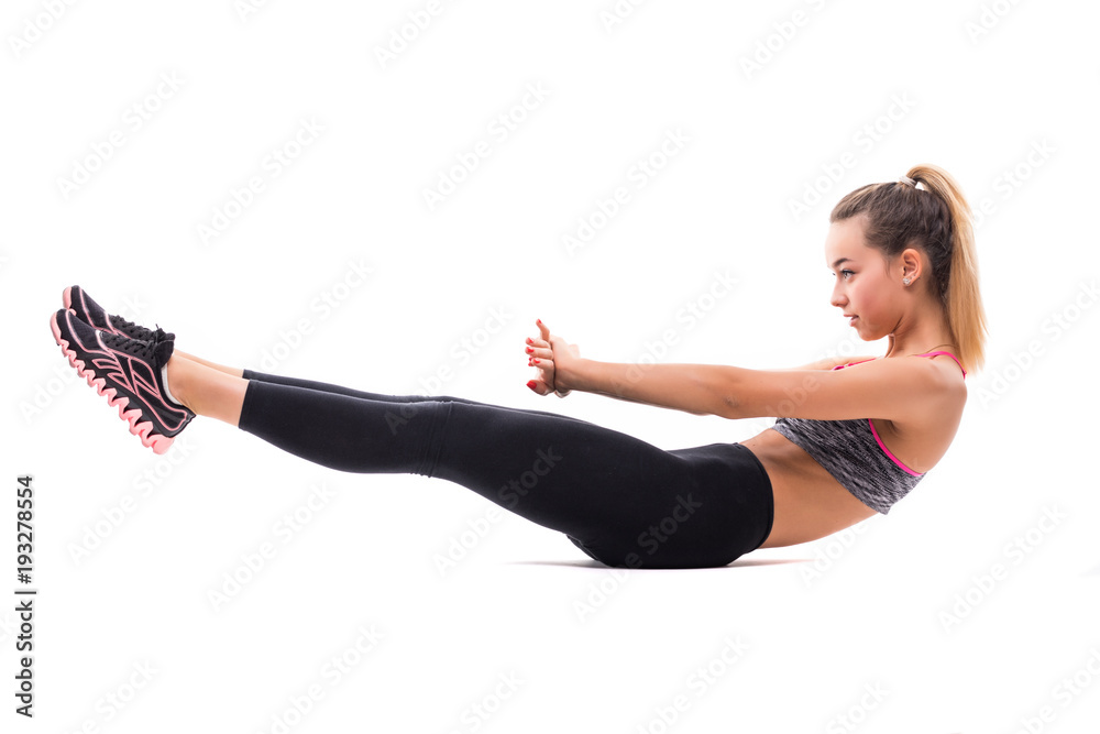 Portrait of young happy smiling blond woman doing exercise abdominal crunches, pumping press, isolated over white background Portrait of young happy smiling blond woman doing exercise abdominal crunches, pumping press, isolated over white background