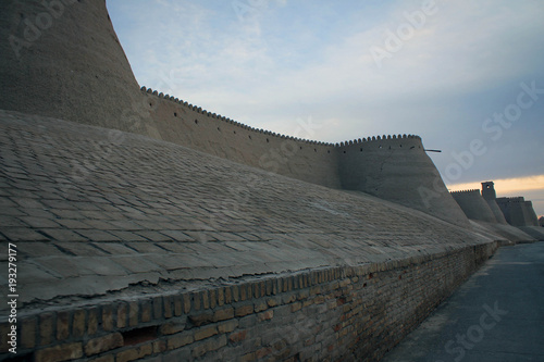 Solid walls of Khiva old town by sunset, Uzbekistan