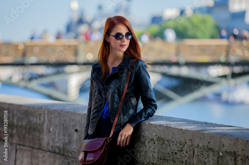 Young girl in sunglasses at Parisian streets