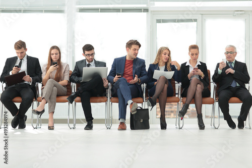 colleagues sitting in the conference room before the meeting © ASDF