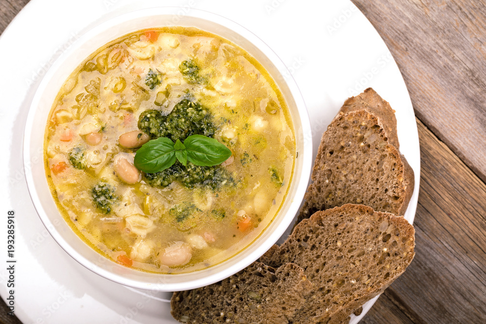 Minestrone with fresh pesto and brown seeded bread. Minestrone with fresh pesto and brown seeded bread.