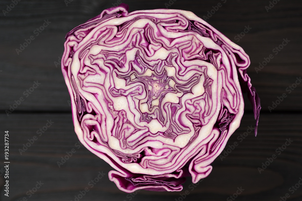 Fototapeta premium red cabbage in a cut on a wooden background