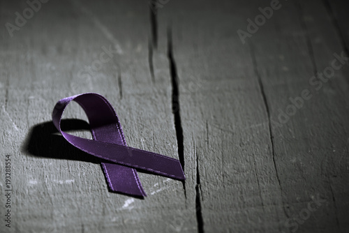 purple ribbon against the violence against women