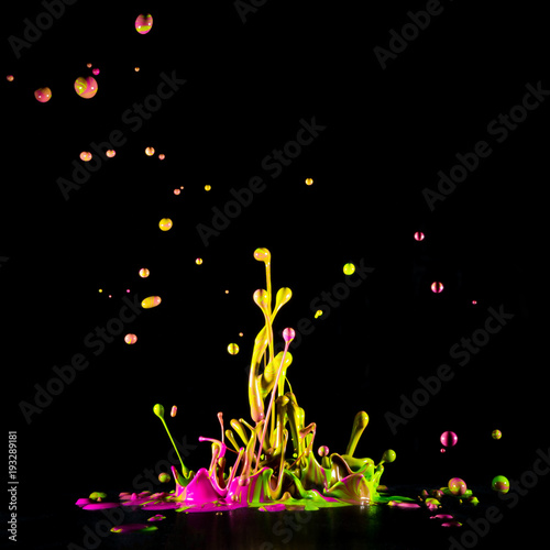 Colour paint splashes isolated on black background
