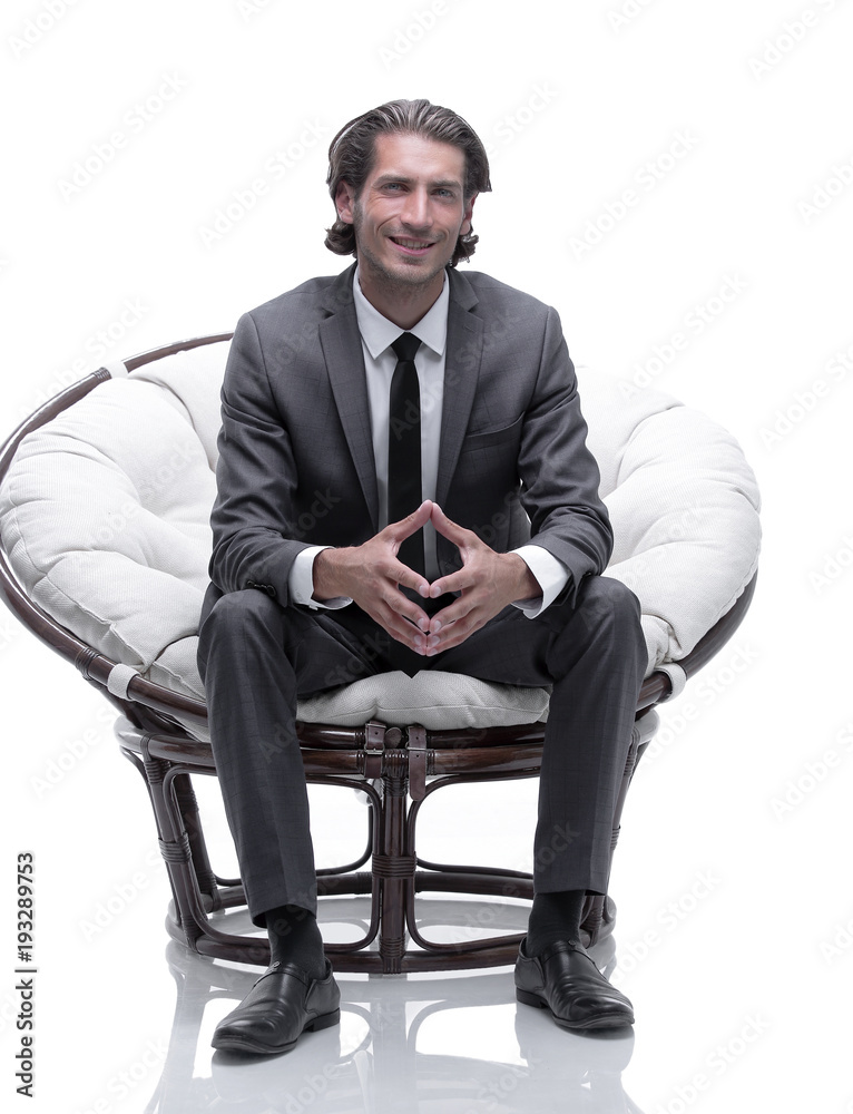 businessman sitting in a comfortable big chair businessman sitting in a comfortable big chair
