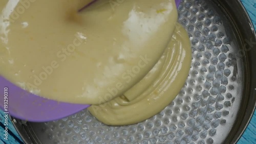 hyperlapse pouring lemon cake dough photo