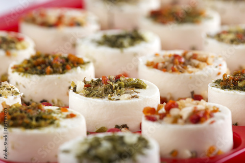 Cheese appetizer with herbs and dried vegetables