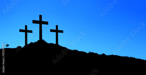 Religious illustration with three crosses on hill and blue sky