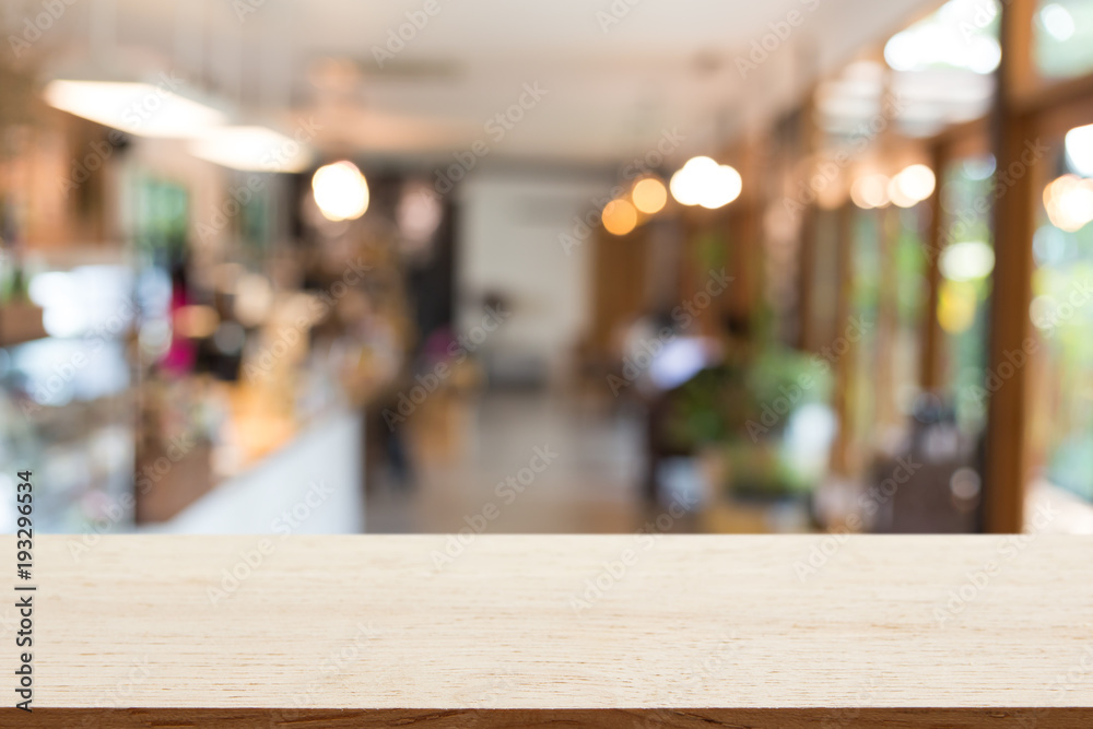 Empty wooden table with background blur of coffee shop , product display template.