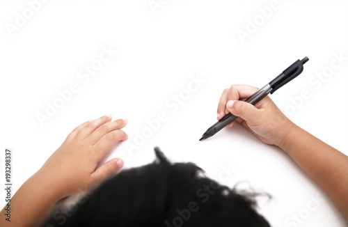 kid's hand writing on white