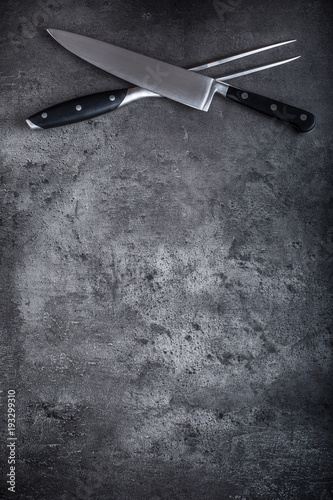 Fork and knife. Fork and knife crossed  on concrete board