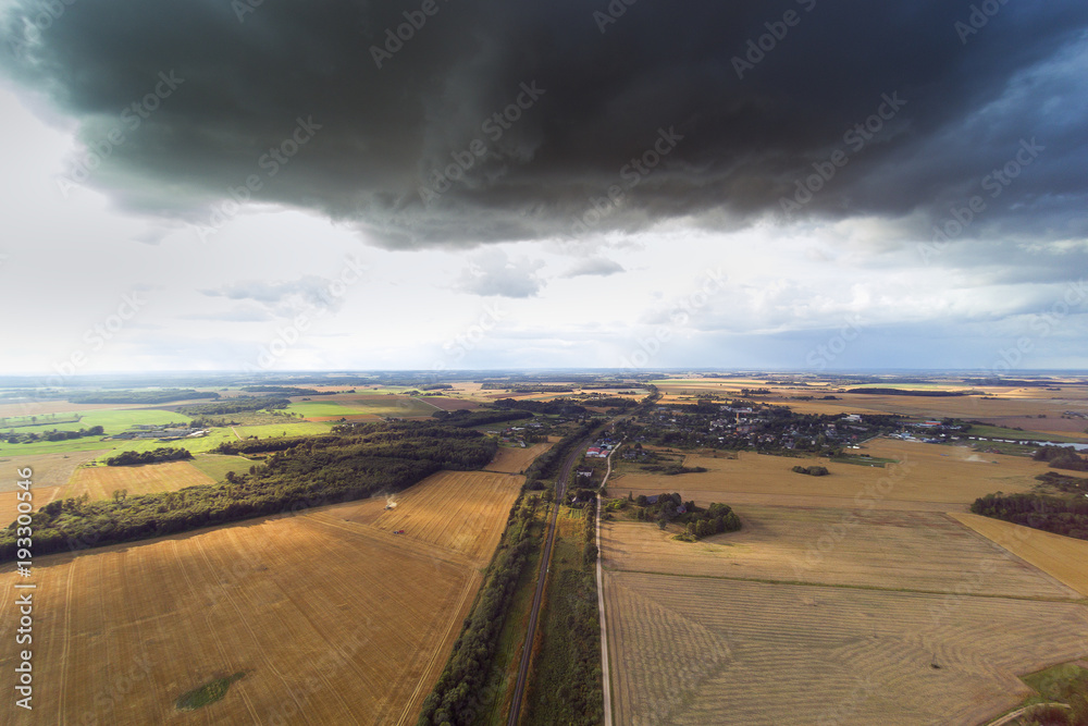Fototapeta premium Dark clouds over land , Tukums area, Latvia.