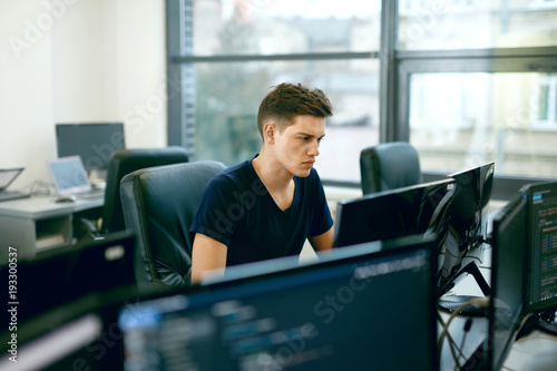 Programming. Man Working On Computer In IT Office