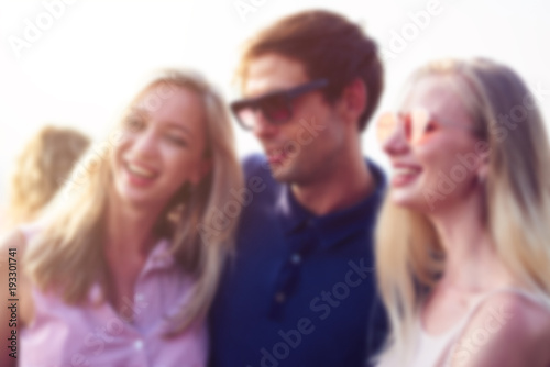 Blurred image of a cool guy resting with his beautiful girls