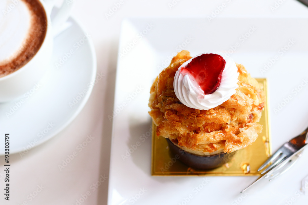 Tasty breakfast in cafe, cappuccino and cake Tasty breakfast in cafe, cappuccino and cake