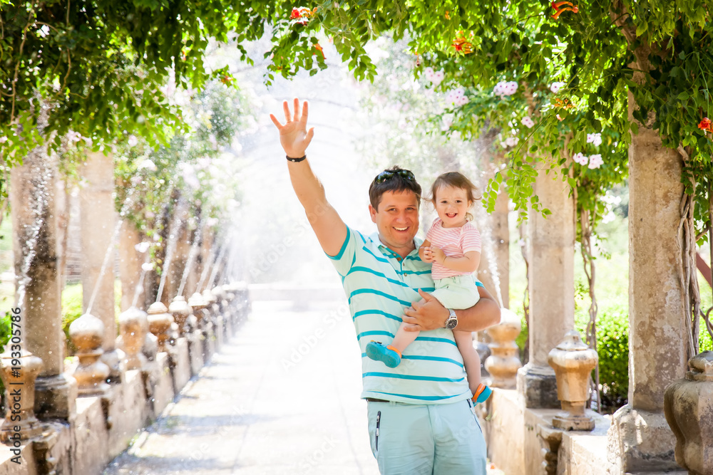 Fototapeta premium 3009780 Father with a daughter in Alfabia gardens in Mallorca