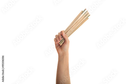 Hand holding a wooden meter on white background